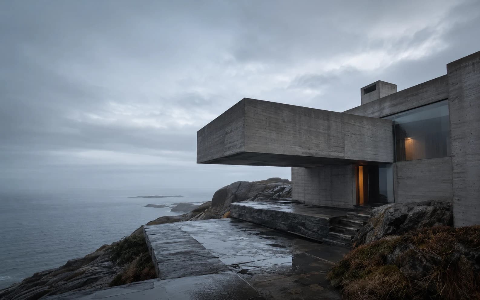Expansive concrete residence integrated into a rocky landscape