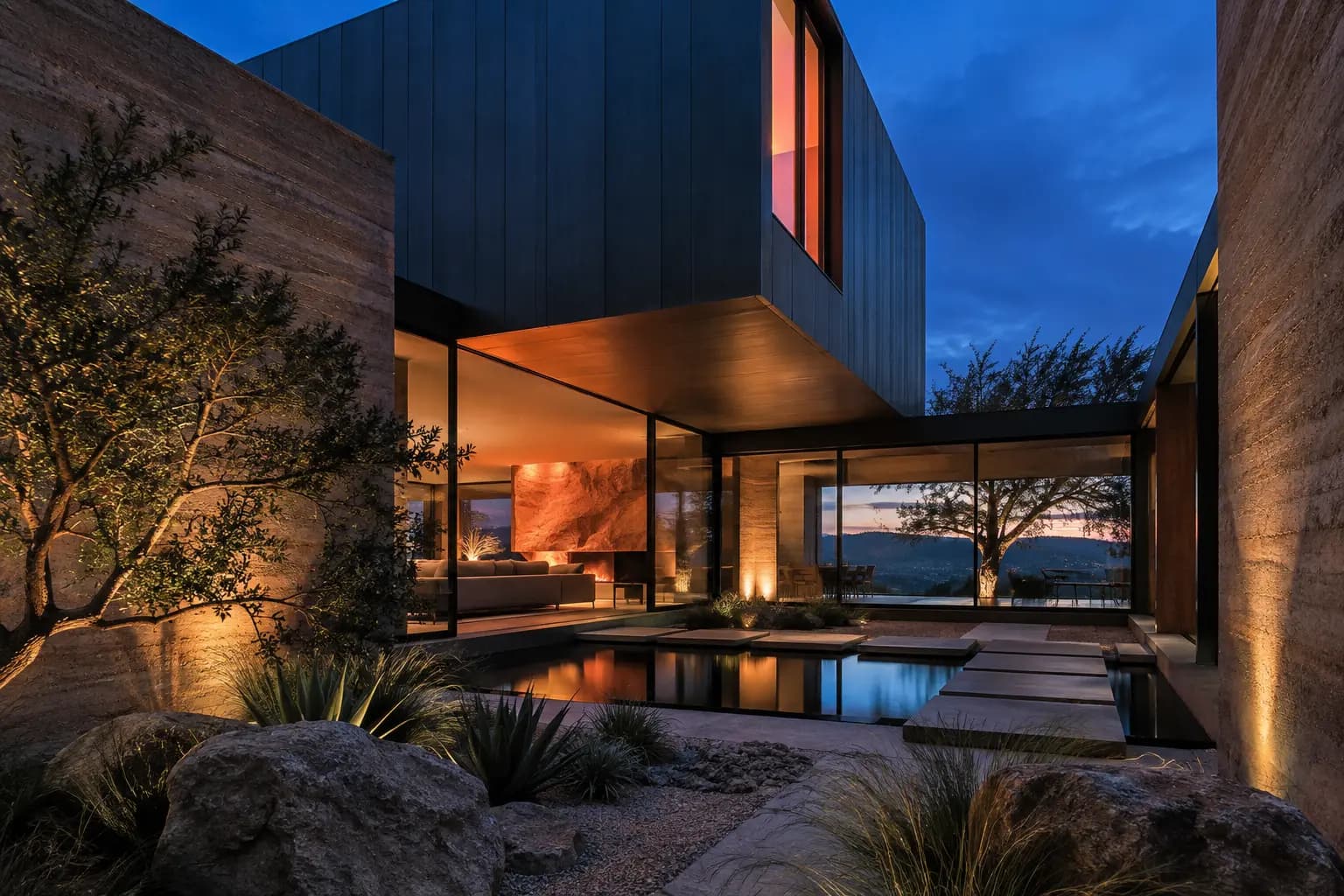 West Lake Hills courtyard residence glowing at dusk
