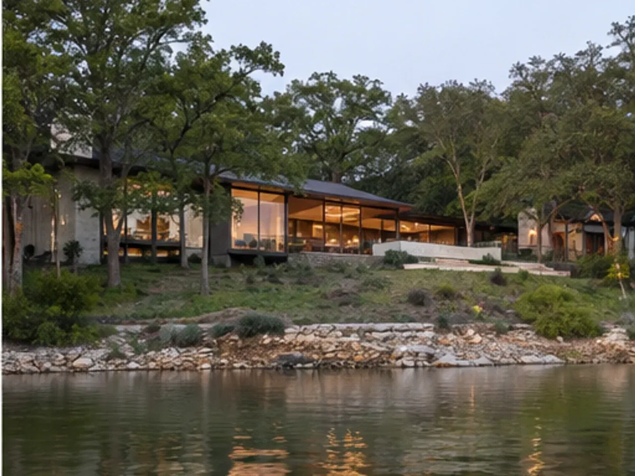 Riverside house among cypress trees